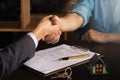 Businessman and customer handshaking before sign agreement franchise contract. Business partnership consult and meeting concept