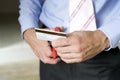 Businessman cutting credit card. Conceptual image Royalty Free Stock Photo