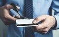 Businessman cutting credit card with scissors. Royalty Free Stock Photo