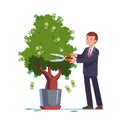 Businessman cutting money off investment tree Royalty Free Stock Photo