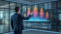 Businessman in a dark suit touching a large transparent interactive screen displaying complex financial data charts and graphs in Royalty Free Stock Photo