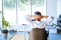 Businessman at the desk in his office resting. Royalty Free Stock Photo