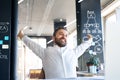 Businessman at the desk in his office stretching arms. Royalty Free Stock Photo