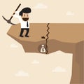 Businessman dig a ground to find a treasure at the