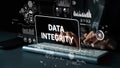 Businessman with digital interface displaying data integrity concept in modern office, technology and cybersecurity Royalty Free Stock Photo