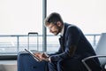 businessman with a digital tablet reading business documents.