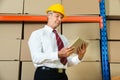 Businessman With Digital Tablet In Warehouse Royalty Free Stock Photo