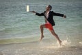 Businessman director running at the beach. director is very carefree businessman. summer inspiration for business man Royalty Free Stock Photo