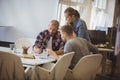 Businessman discussing with colleague during meeting