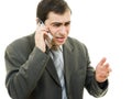 Businessman in distress speaks by phone Royalty Free Stock Photo