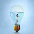 Businessman diver in bulb Royalty Free Stock Photo
