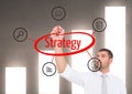 Businessman doing a graphic about STRATEGY in the screen. Graph wall background Royalty Free Stock Photo