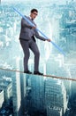 The businessman doing tightrope walking in risk concept Royalty Free Stock Photo