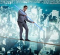 Businessman doing tightrope walking in risk concept Royalty Free Stock Photo