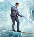 Businessman doing tightrope walking in risk concept Royalty Free Stock Photo