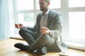 Businessman doing yoga Royalty Free Stock Photo