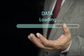 Businessman downloading digital business data form website and cloud.