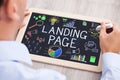 Businessperson Drawing Landing Page Concept On Slate