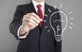 Businessman drawing idea light bulb Royalty Free Stock Photo