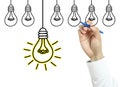 Businessman drawing light bulb Royalty Free Stock Photo