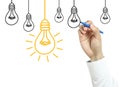 Businessman drawing light bulb concept Royalty Free Stock Photo