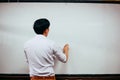 Businessman drawing and writing something on white board - with copy space. Royalty Free Stock Photo