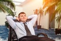Businessman is dreaming about vacations Royalty Free Stock Photo