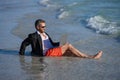 Businessman dreams on summer business in sea. Summer business. Businessman relaxing at the beach. businessman relax at