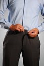 Businessman Dressing, Pulling His Pants Placket Royalty Free Stock Photo