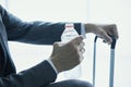 Businessman drinking bottled water at the airport Royalty Free Stock Photo