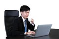 Businessman drinking coffee / tea and using computer Royalty Free Stock Photo