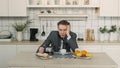 Businessman Drinking Out of Coffee Pot in Kitchen Royalty Free Stock Photo