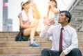 Businessman drinking water from a bottle after walking Royalty Free Stock Photo