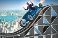 The businessman driving sports car on roller coaster