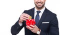 Businessman drop ethereum into piggy bank conceptual toothy smile isolated