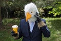 Businessman with an eagle face making a phone call Royalty Free Stock Photo