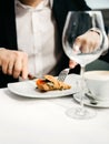 Businessman eating breakfast. Man eats oatmeal with fruits and nuts. Healthy breakfast Royalty Free Stock Photo