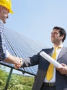 Businessman and electrician shaking hands Royalty Free Stock Photo