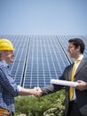 Businessman and electrician shaking hands Royalty Free Stock Photo