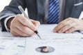 Businessman in elegant suit at a business meeting signing contracts in the office Royalty Free Stock Photo