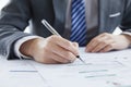 Businessman in elegant suit at a business meeting signing contracts in the office Royalty Free Stock Photo