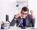 Businessman employee talking on the office phone Royalty Free Stock Photo