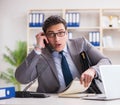 Businessman employee talking on the office phone Royalty Free Stock Photo