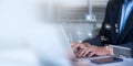 Businessman employing artificial intelligence (AI) for data management to business analytics using charts, metrics,