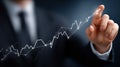 Businessman engages with a virtual screen displaying a rising growth graph alongside financial data for strategic planning Royalty Free Stock Photo