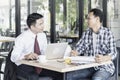 Businessman and Engineer meeting in cafe.