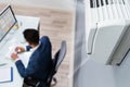 Businessman Enjoying The Cooling Of Air Conditioner Royalty Free Stock Photo