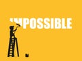 Businessman erasing the word impossible.