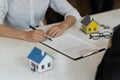 Businessman and estate agent signing a document for house deal Royalty Free Stock Photo