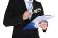 Businessman Examining Document On Clipboard